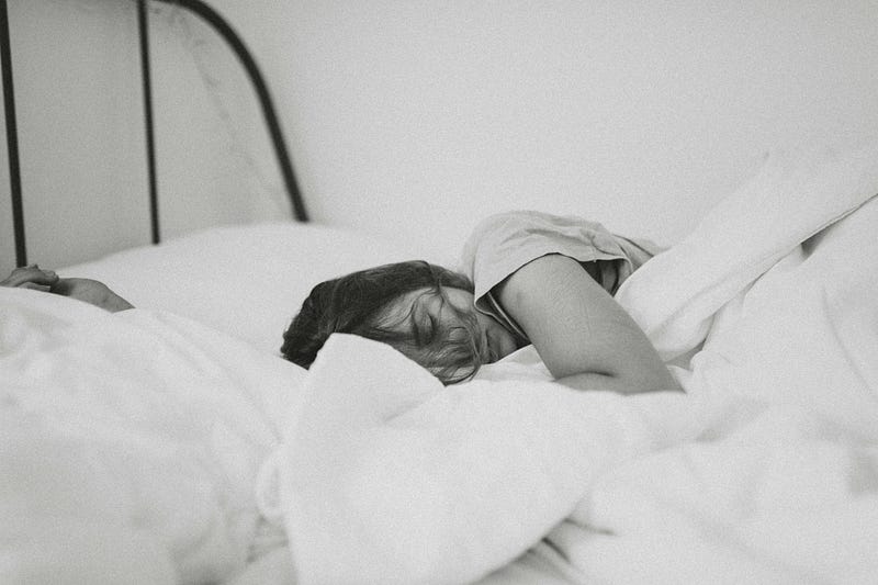 A person sleeping peacefully, illustrating the concept of facial expressions during sleep.